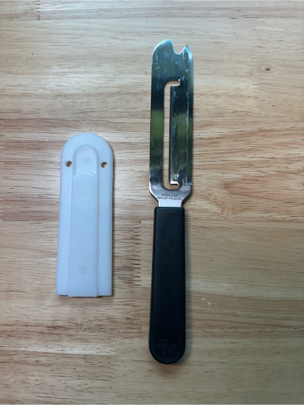 The Pampered Chef Cheese Plane with Black Handle and White Sheath #1125
